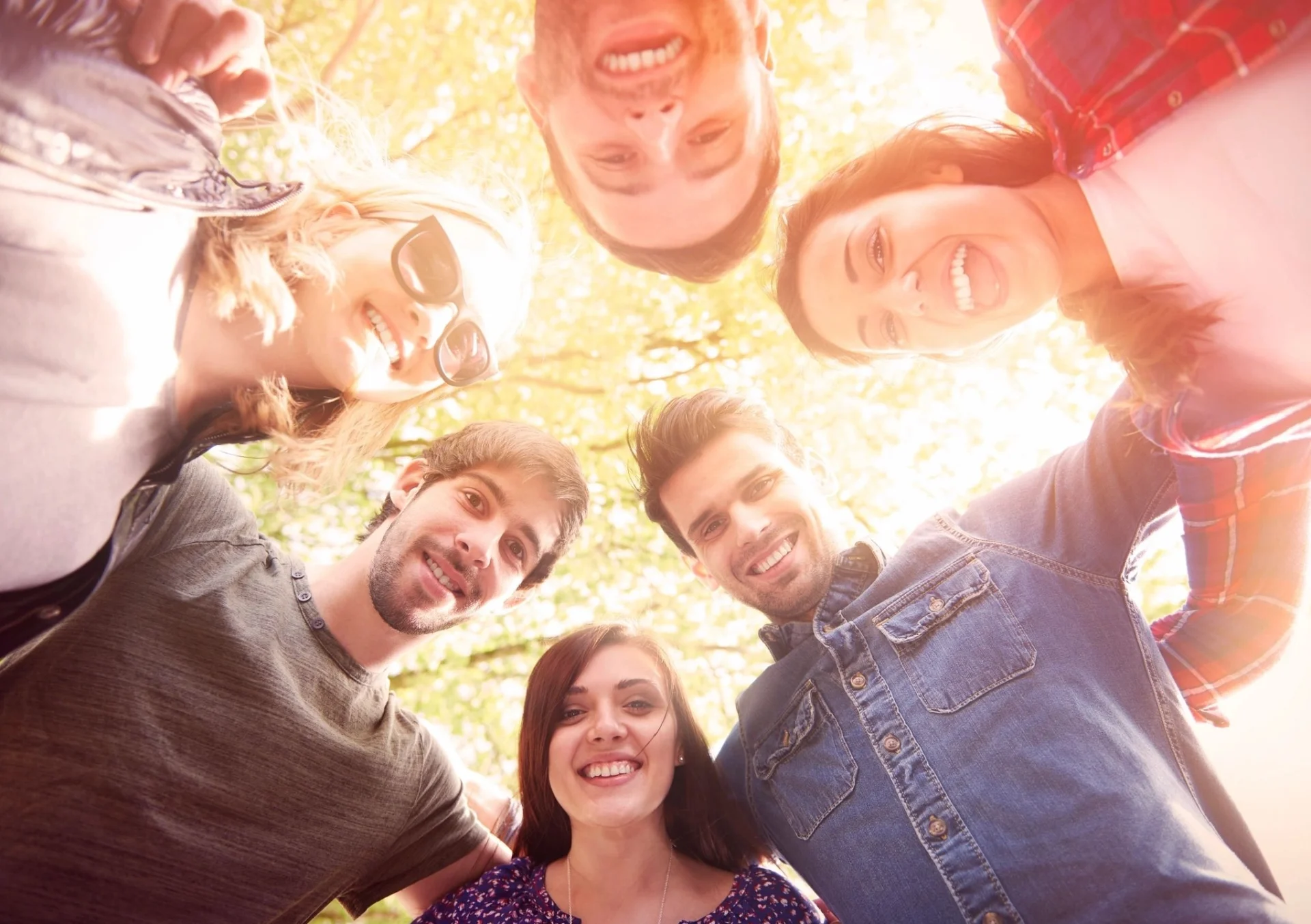 A group of people standing around each other.